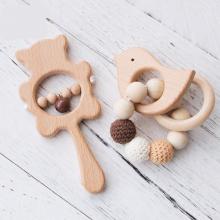 photograph of cute wooden baby teethers
