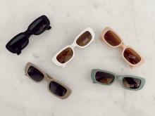 Children's sunglasses in black,taupe, white, pink and green colours