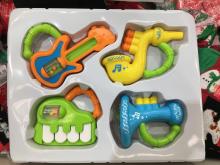 This is a photograph of the Dimmeys Babe Rattle 4 piece set as placed in the box as sold.
