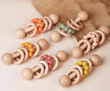 Photograph of wooden baby rattles with silicone beads