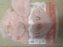 Pink fluffy pig in pink and white packaging