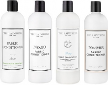 Bottles of The Laundress fabric conditioners showing the different labels