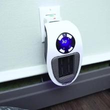 Ozzi Mozzie heater plugged into wall socket.