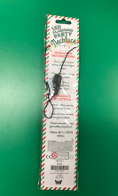 LED light up Christmas necklace, back of packaging