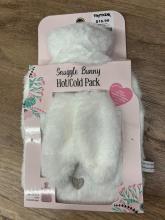 White bunny toy in pink packaging